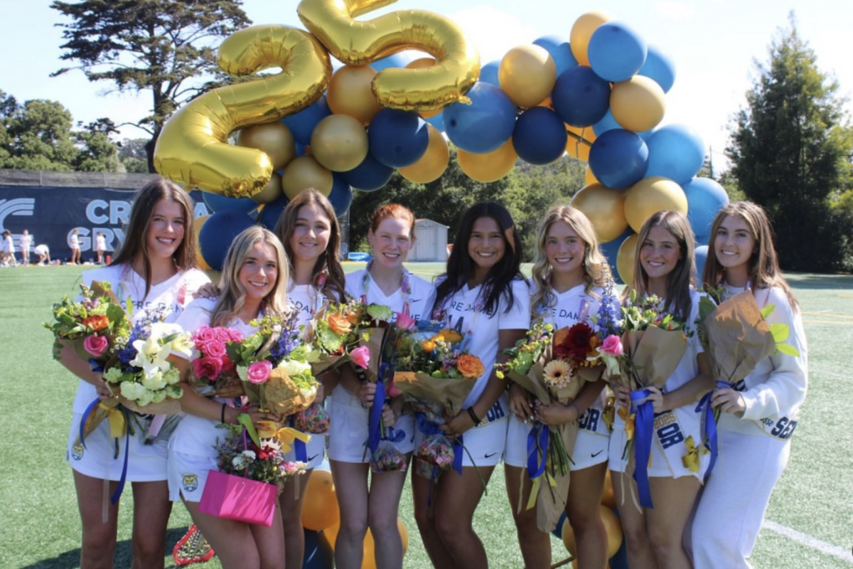 Lacrosse senior members gather together during their senior celebration.